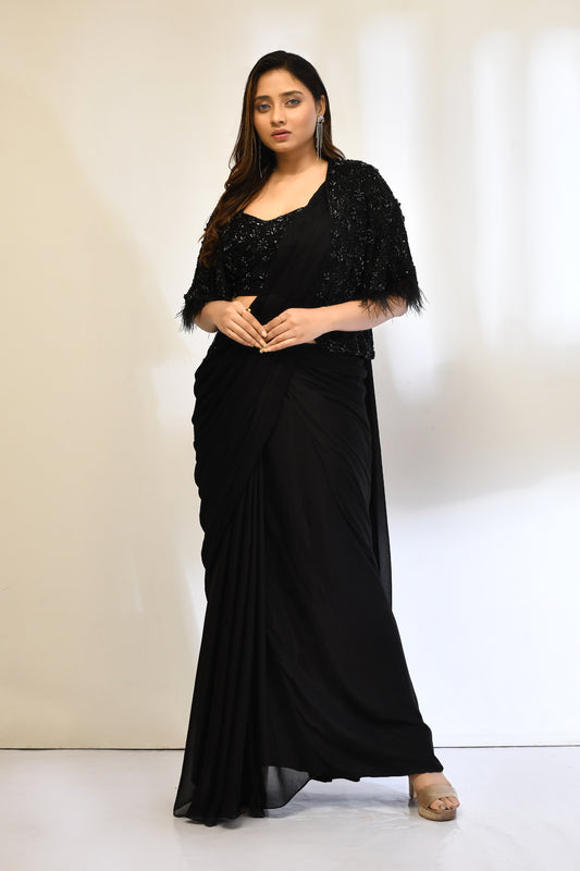 Black saree with embellished jacket suited for cocktail events.
