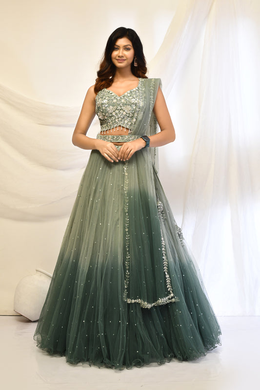 Green ombre lehenga choli ideal for festive celebrations.