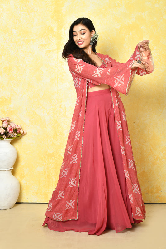 Peach pink jacket set suited for festive cocktail evenings.