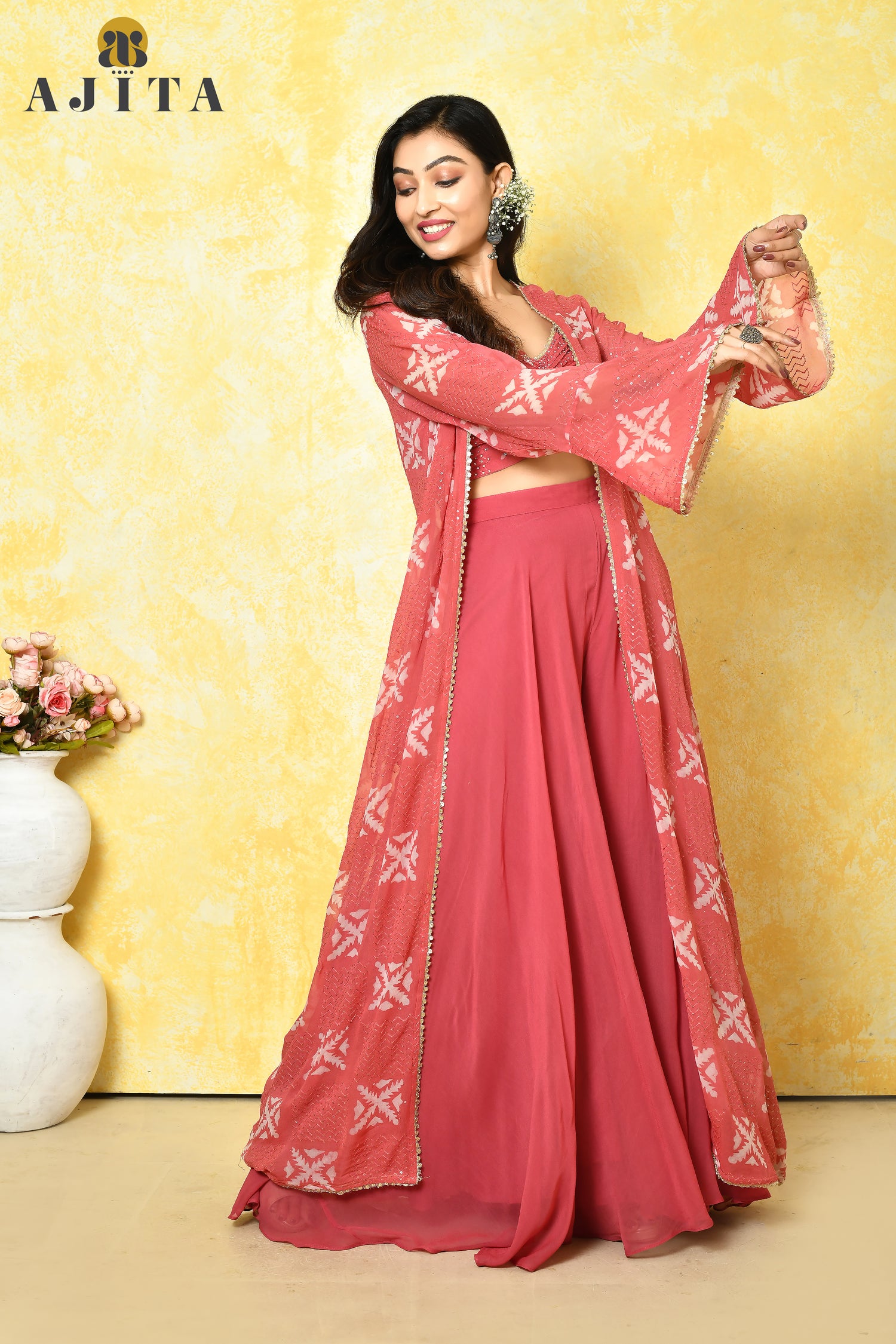 Peach pink georgette jacket set ideal for cocktail and reception events.