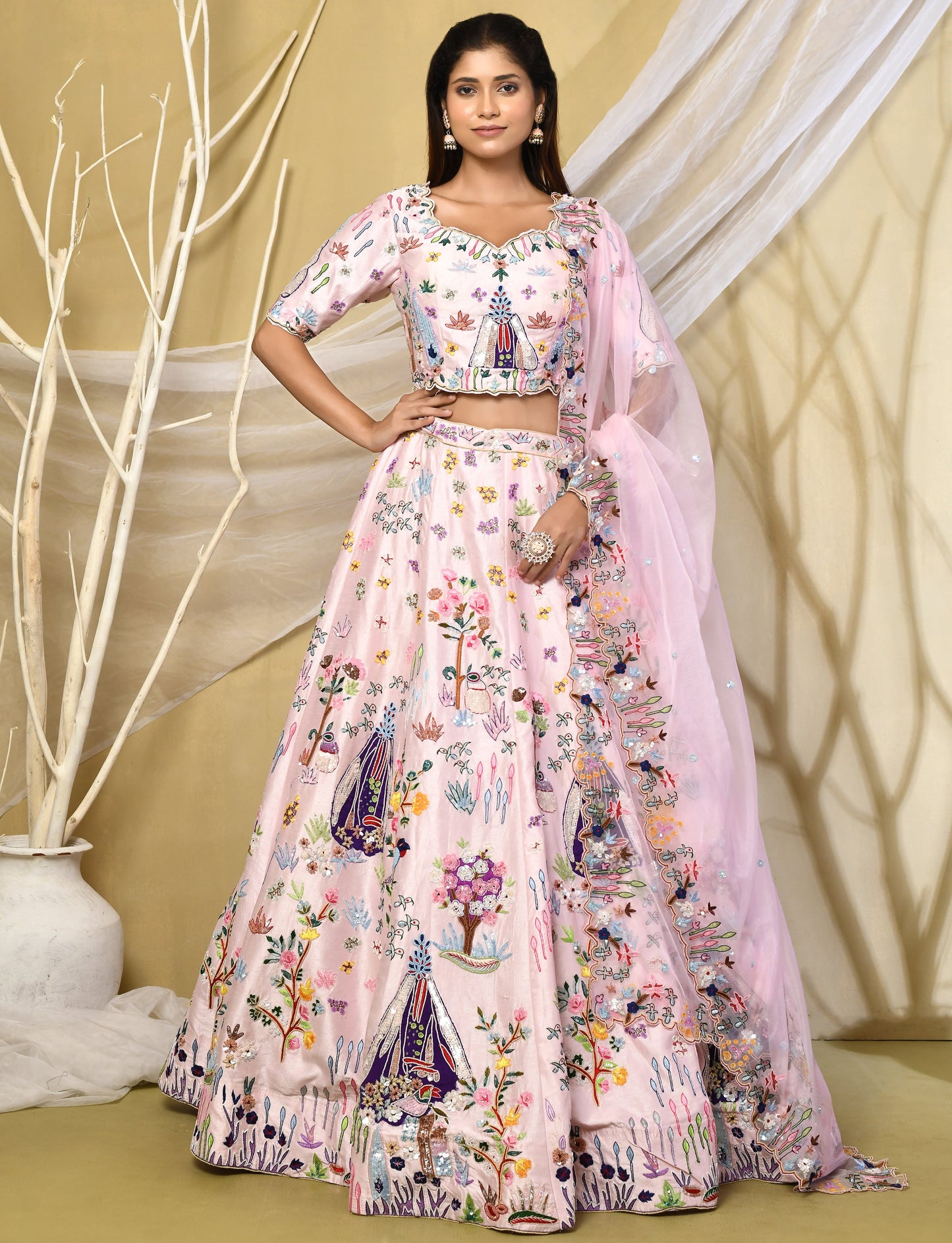 Baby pink raw silk lehenga with vibrant multicoloured floral embroidery