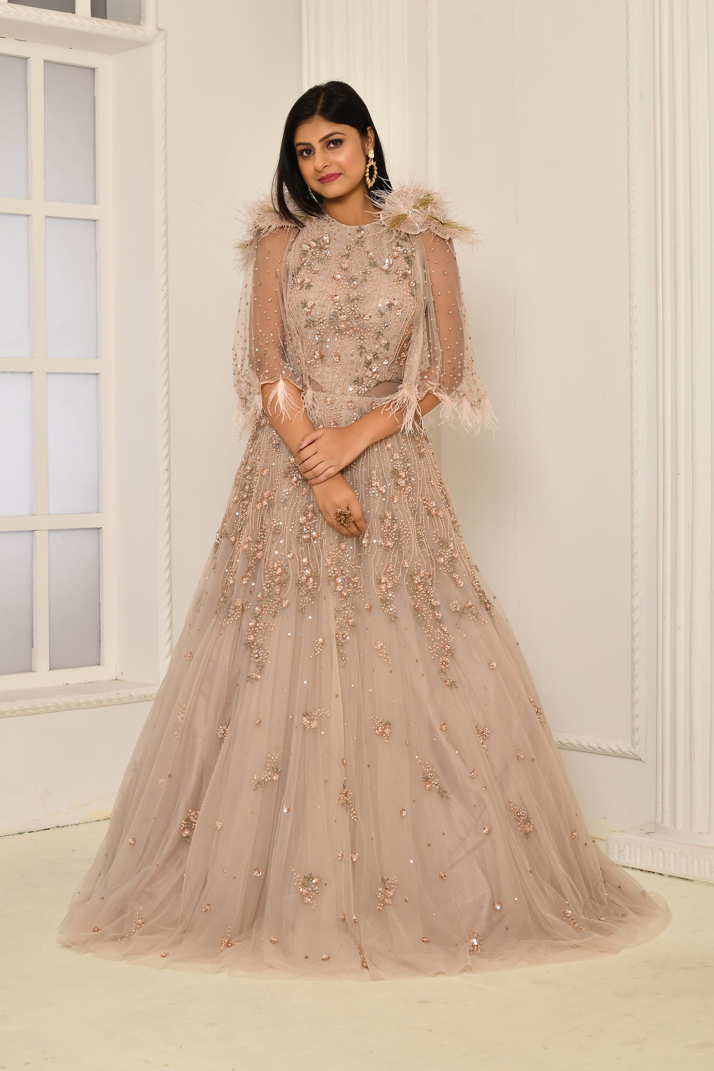 Elegant net cape gown for bridesmaids or cocktail events in pastel hues
