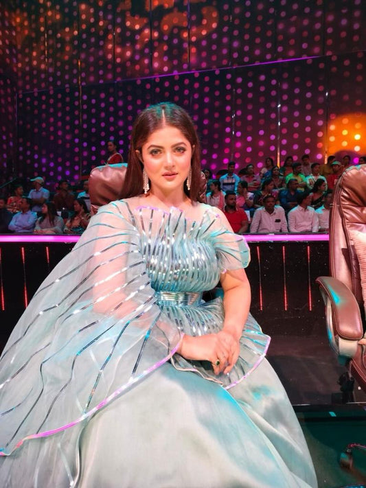 Gown on stage suited for award functions and grand celebrations.