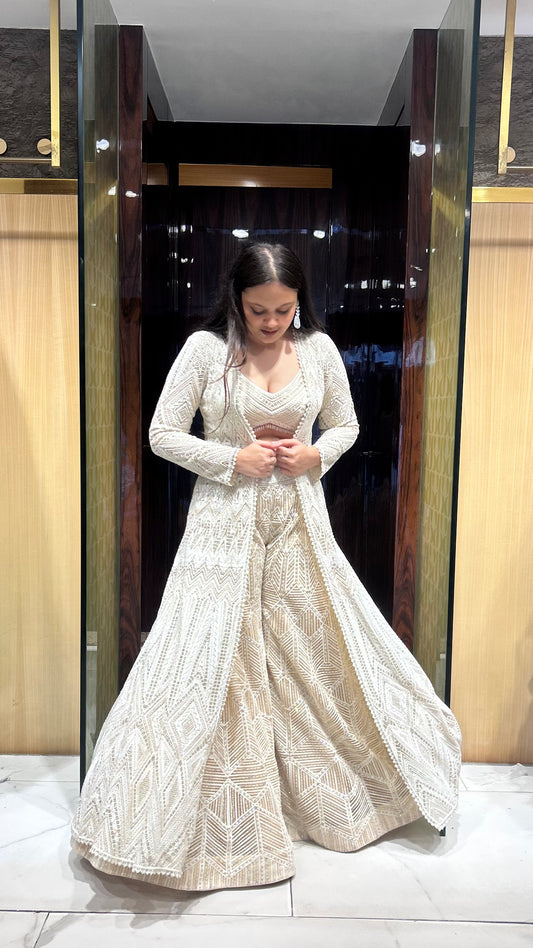 Ivory colour designer inspired semi-bridal jacket lehenga set.