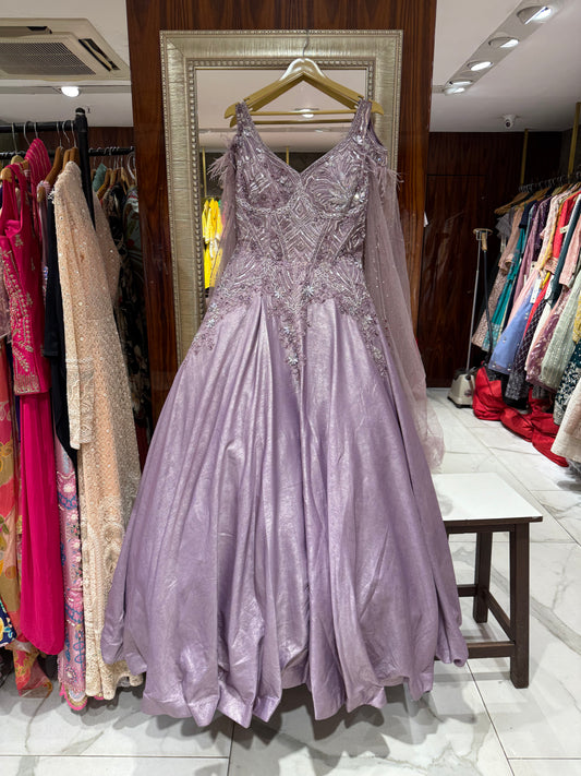 Lilac embroidered gown with feathers for luxury festive occasions.