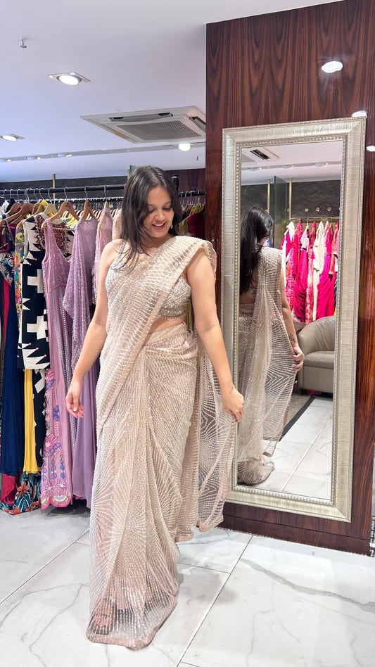 Inaaya Light Peach Net Saree with Sequin & Pearl Embroidery