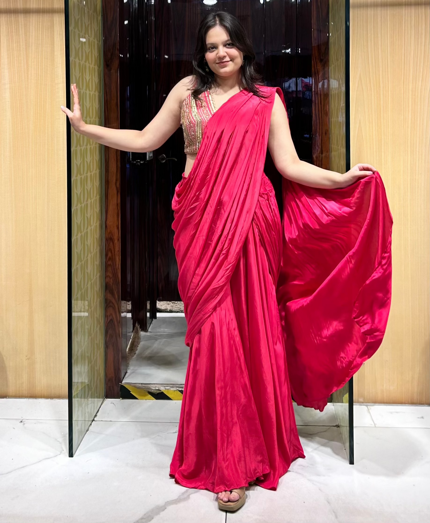 Rani pink drape pant set with gold hand embroidery and attached drape – perfect for festive occasions.