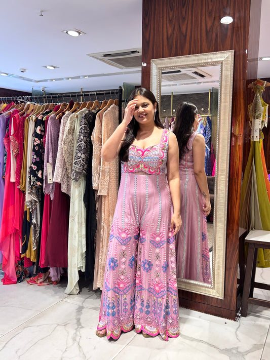 Pink floral embroidered jumpsuit perfect for festive daytime events.