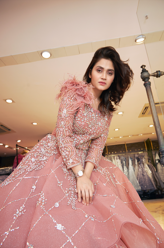 Pink embellished gown suited for festive receptions and events.
