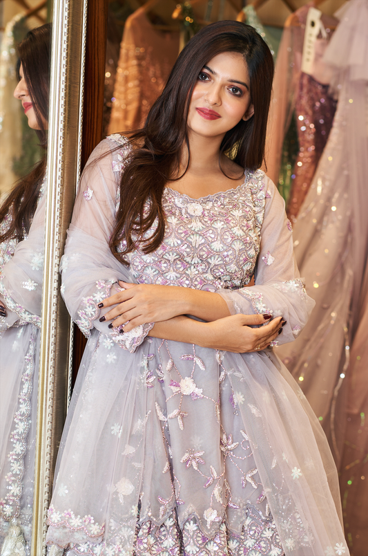 Embellished traditional dress perfect for festive wedding occasions.