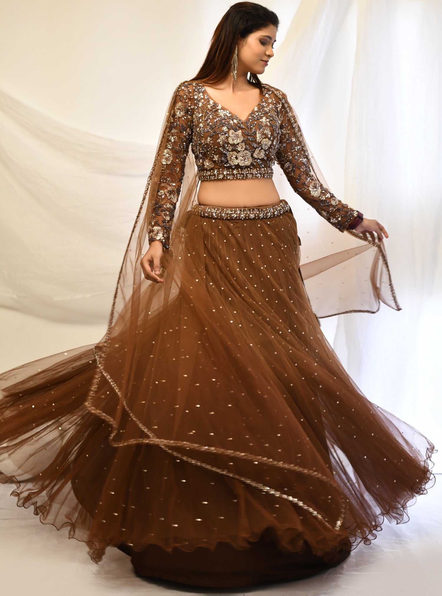 Brown embroidered lehenga choli set perfect for sangeet evenings.