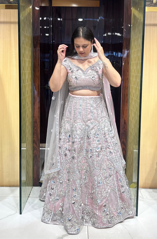 Organza lehenga with leather patches and floral accents
