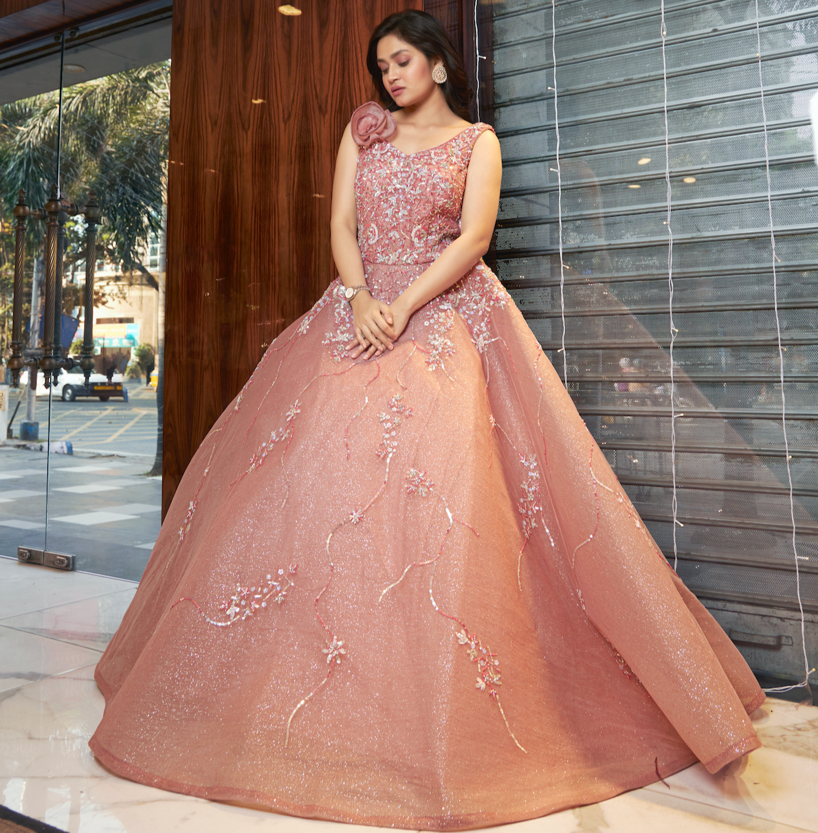 Peach princess ball gown with hand-embroidered sequins and stone detailing