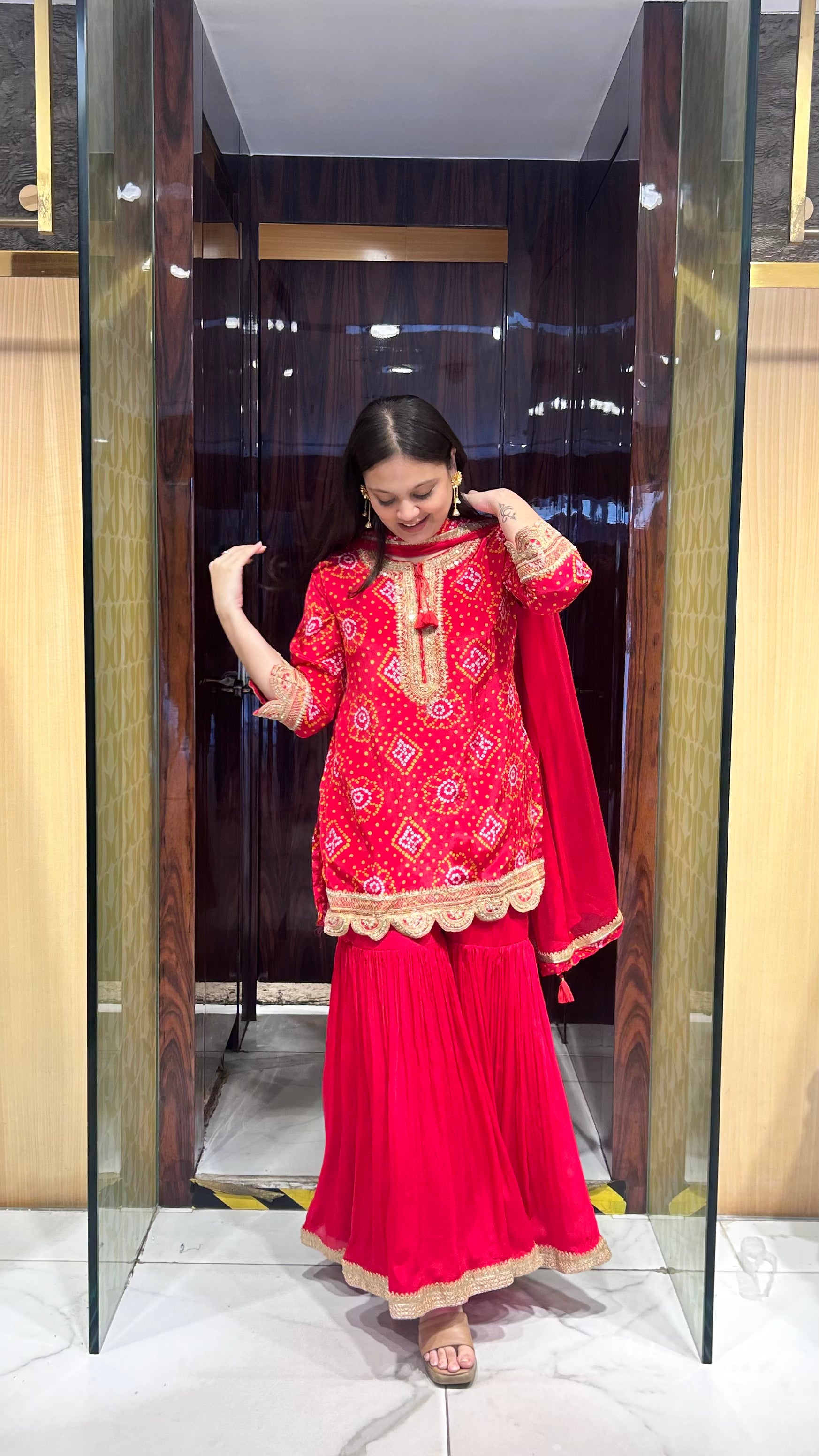 Zari lace border on vibrant bandhej/bandhani gharara set