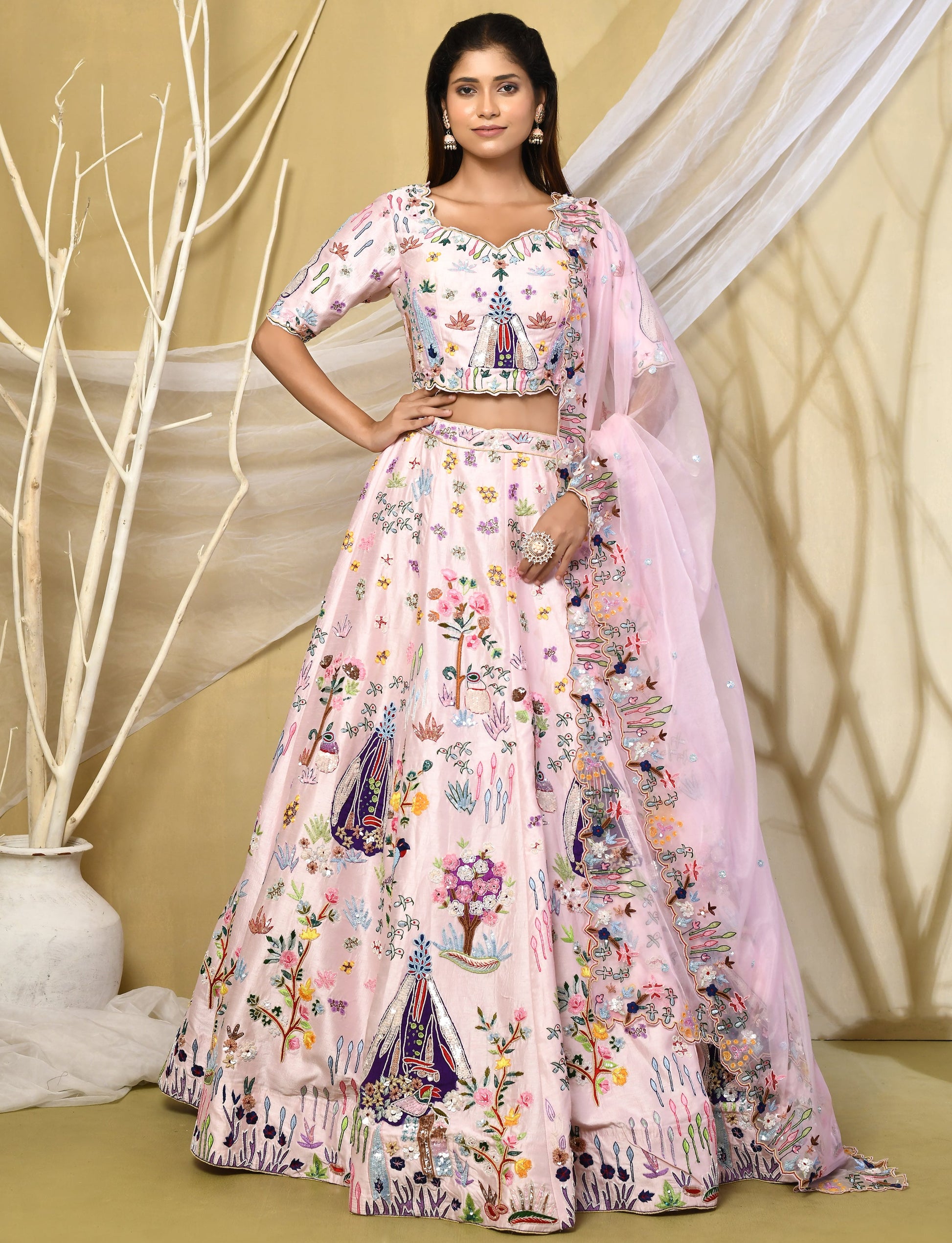 Baby pink raw silk lehenga with vibrant multicoloured floral embroidery