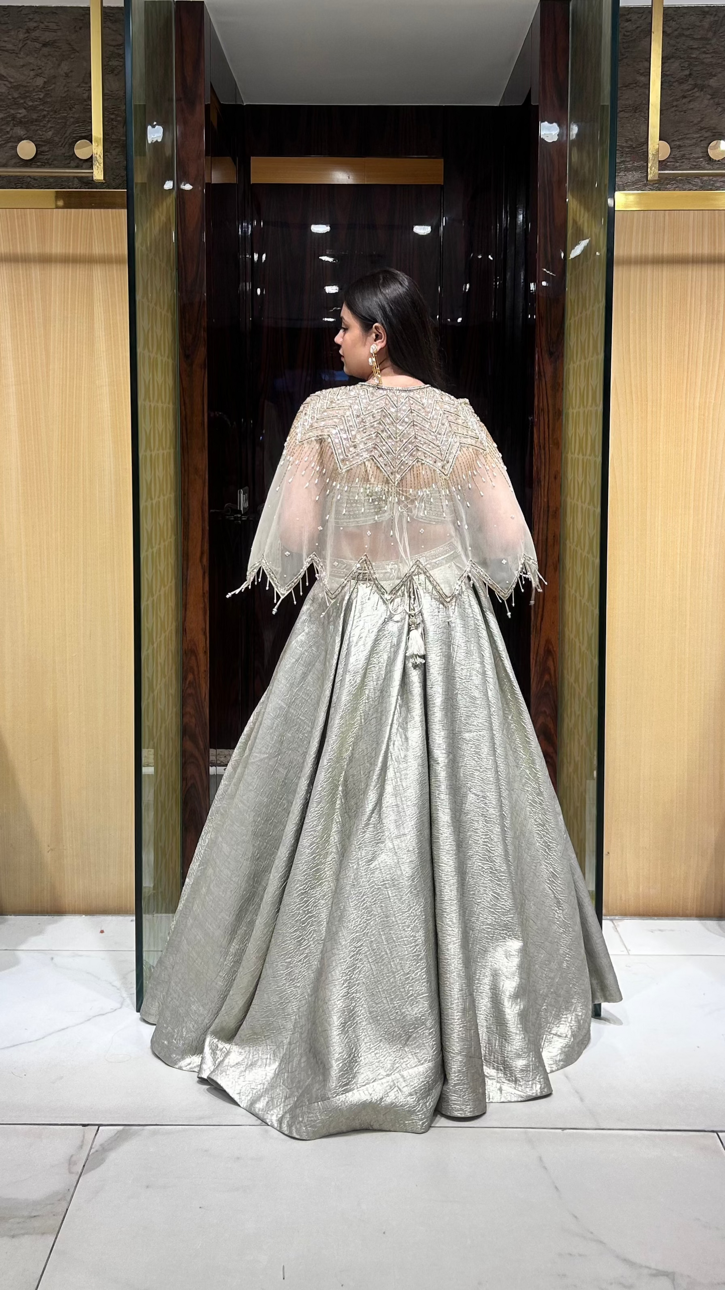 Evening event lehenga with crystal-embroidered scalloped net cape