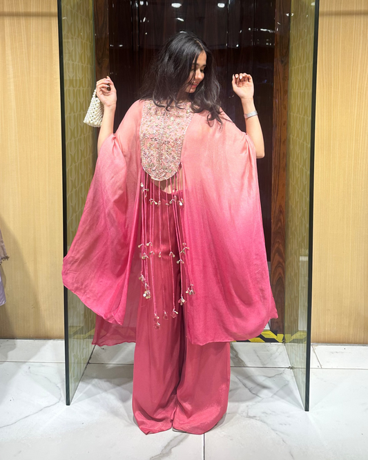 Indo-western kaftan set with pants and a bustier. Shaded peachish pink with fun hangings. Perfect for mehendi, carnival, haldi