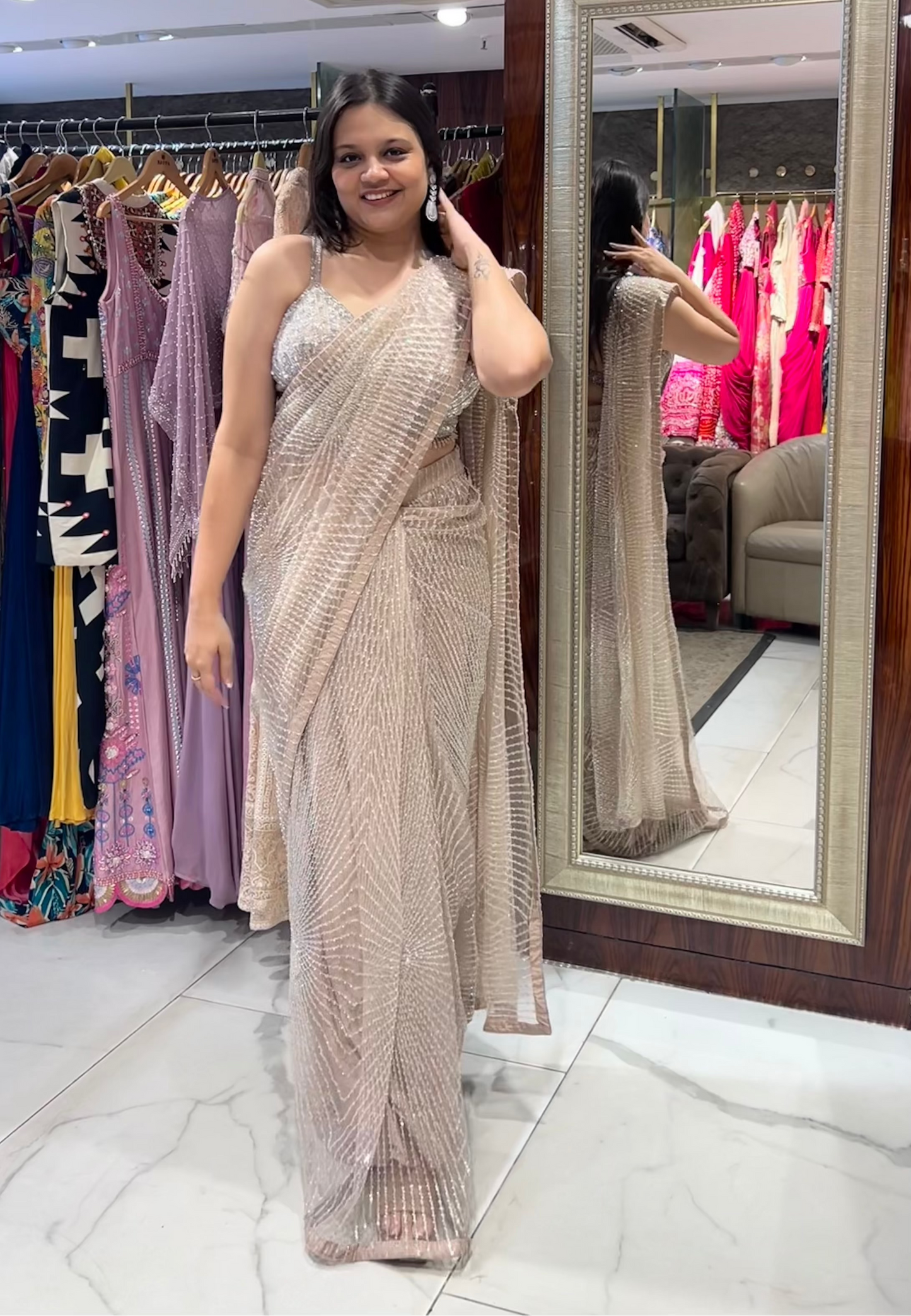 Inaaya Light Peach Net Saree with Sequin & Pearl Embroidery