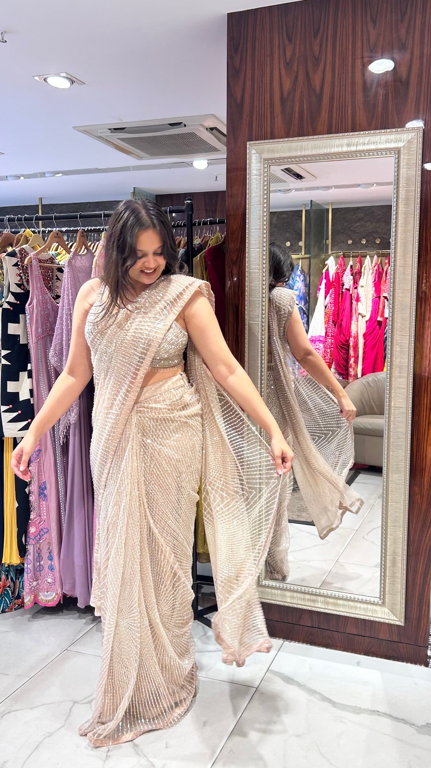 Inaaya Light Peach Net Saree with Sequin & Pearl Embroidery