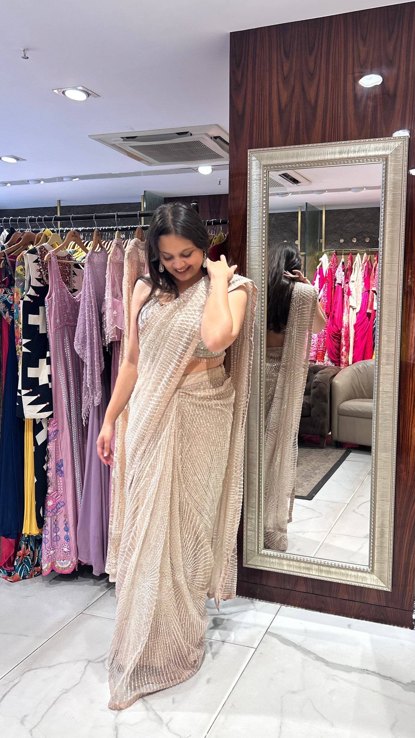 Inaaya Light Peach Net Saree with Sequin & Pearl Embroidery