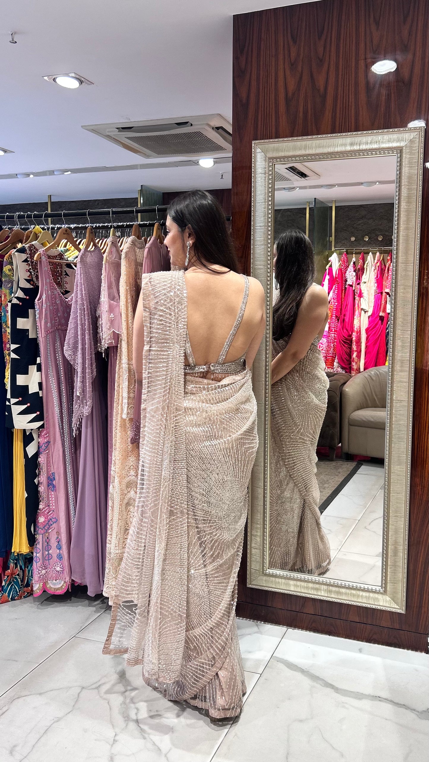 Inaaya Light Peach Net Saree with Sequin & Pearl Embroidery