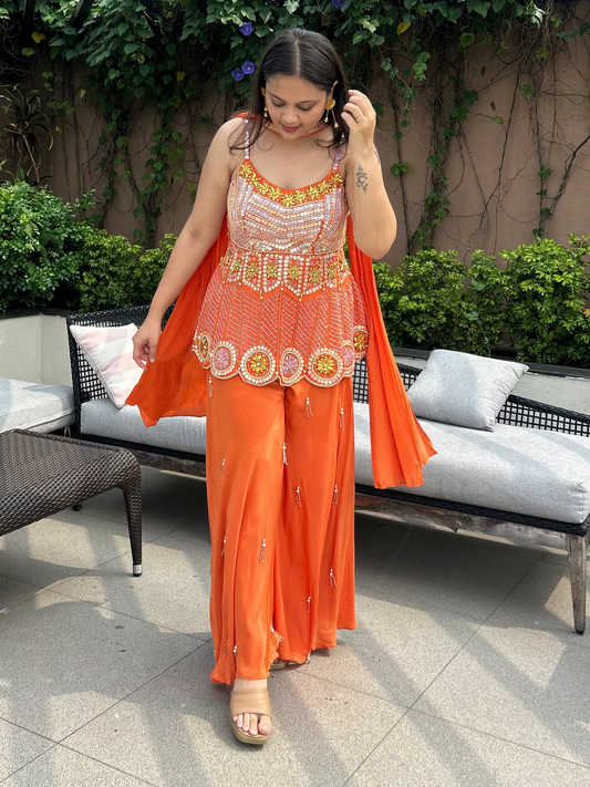 Carnival ready with PDP inspired orange coloured indo-western outfit with multicoloured vibe.