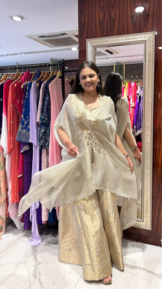 Vamika Champagne Tissue Sharara with Embroidered Cape