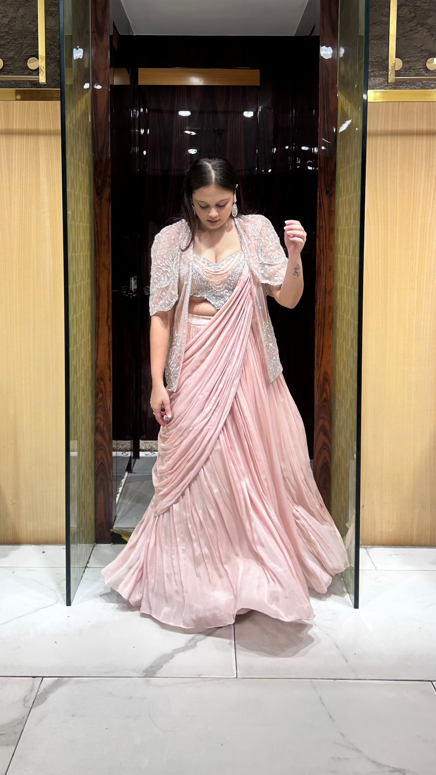Hand embroidered designer cut blouse in peach drape lehenga set