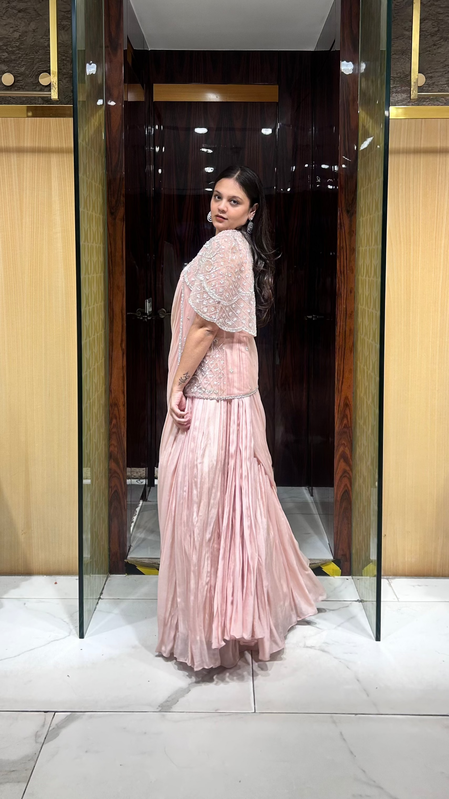 Peach jacket and drape lehenga outfit for bridesmaids and wedding guests