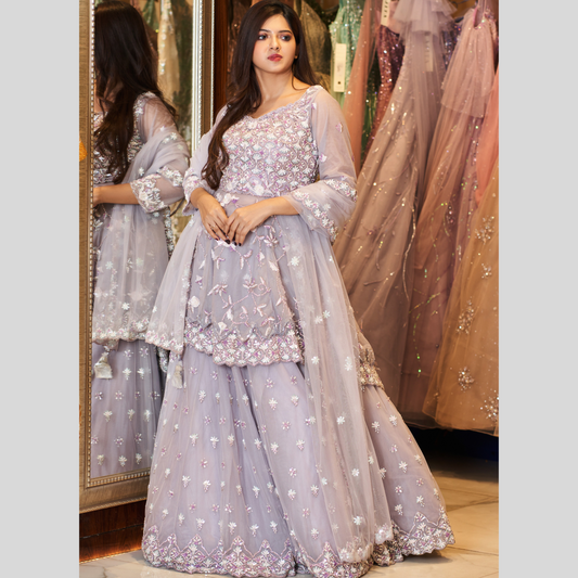 Nikaah Nikah ready with this peplum hand embroidered designer inspired lehenga lavender. 