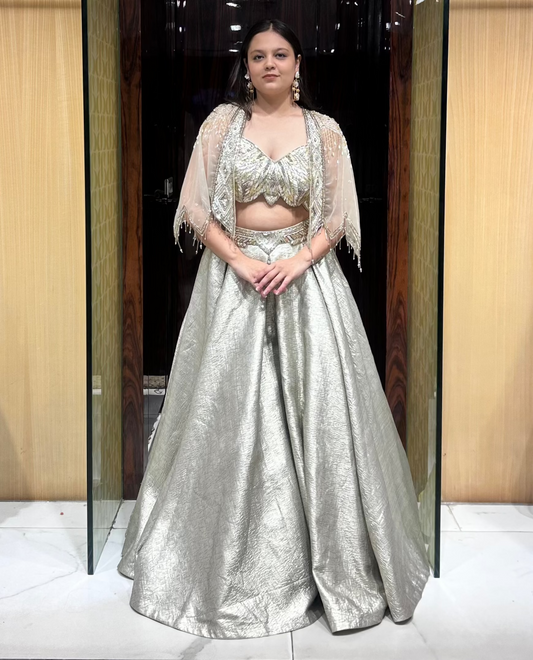 Sophia grey-gold lehenga with strappy blouse and scalloped cape