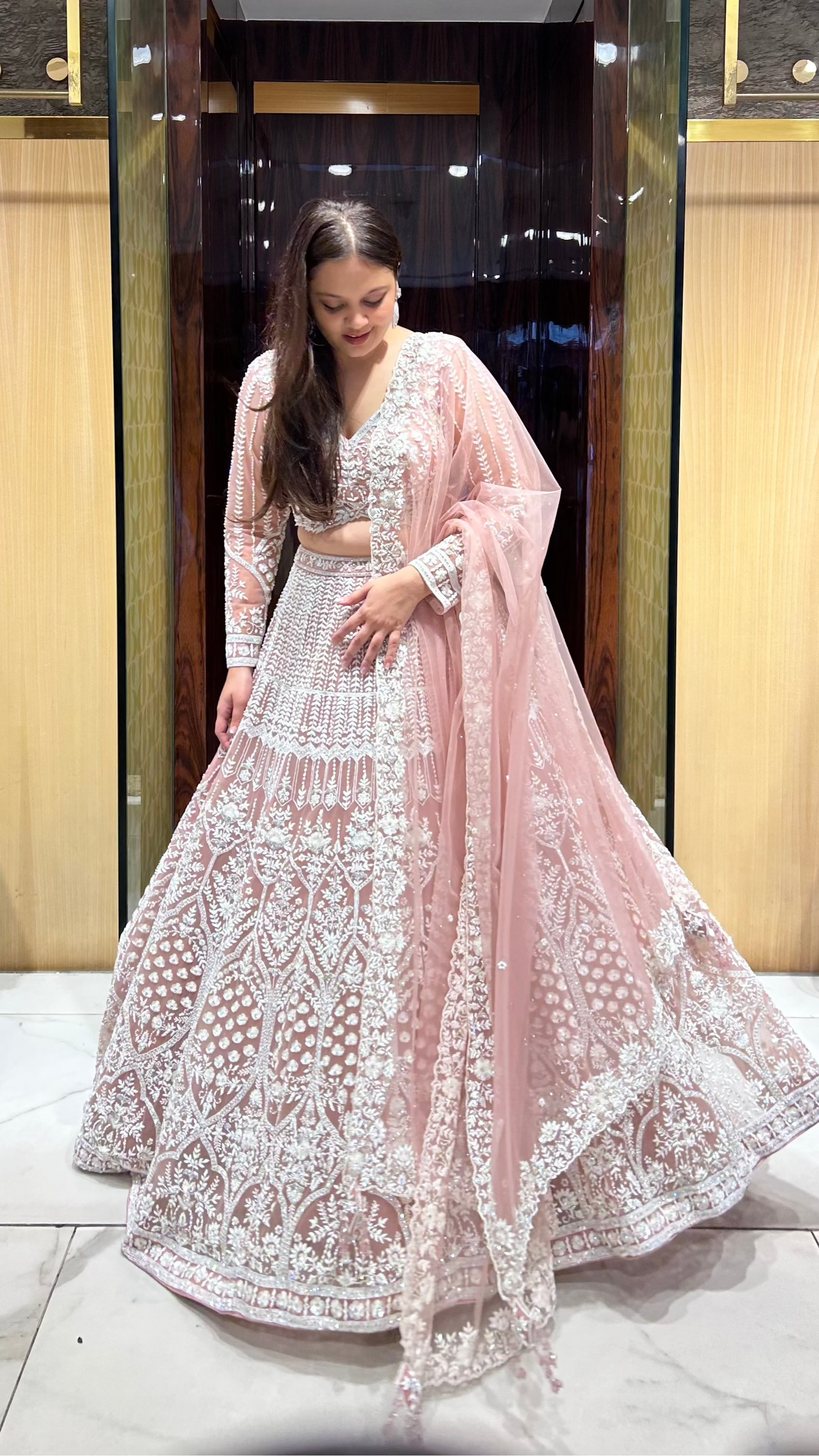 Peach pink designer lehenga for bride’s sangeet, engagement or reception
