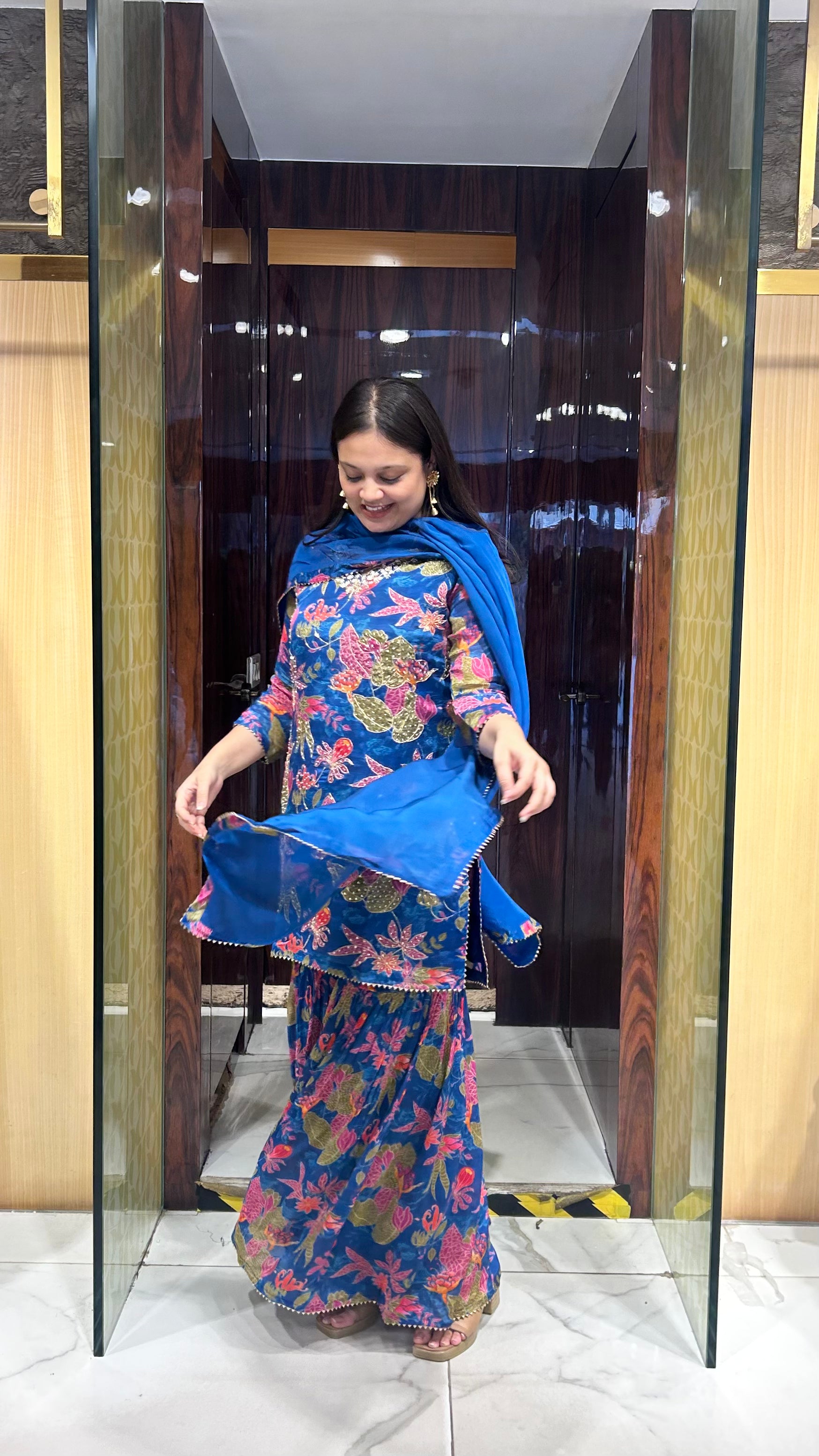 Close-up of hand embroidery on neckline of designer gharara set