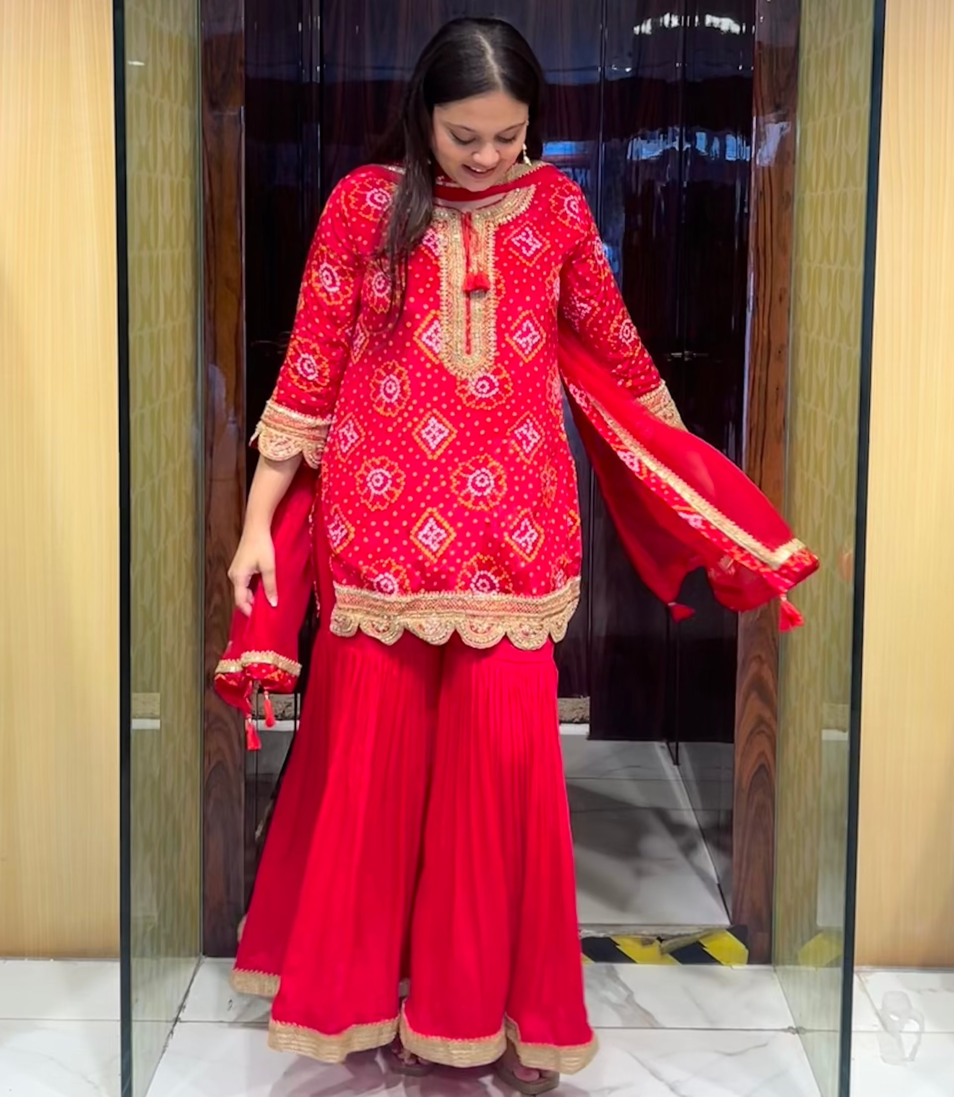 Red bandhani printed gharara set with hand embroidery